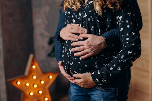 image of a pregnant woman holding her stomach